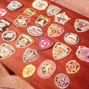 A lot ofᝰpolice and firemen patches very